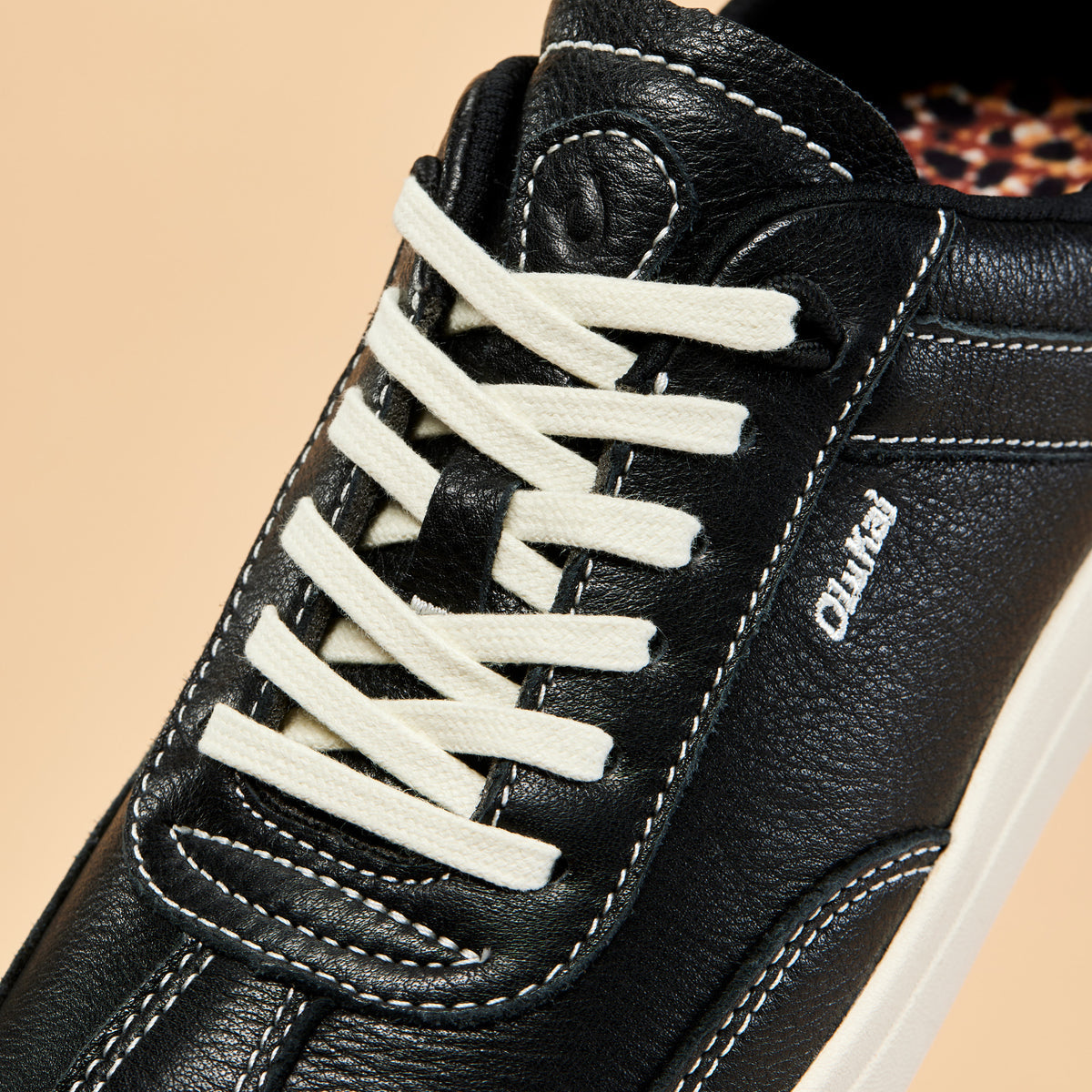 OluKai Trending | Hā‘upu Women’s Leather Sneakers - Onyx
